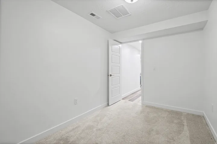 Neutral-toned carpeting paired with white walls