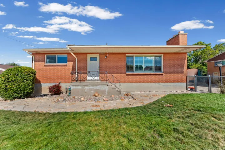 Brick exterior featuring a stone walkway