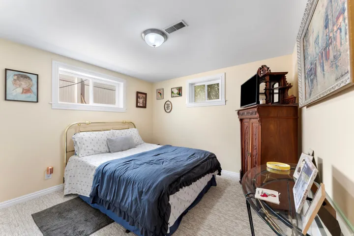 Carpeted room with cream-colored walls and white trim