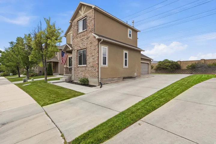 Two-story exterior with a combination of brick and stucco finishes