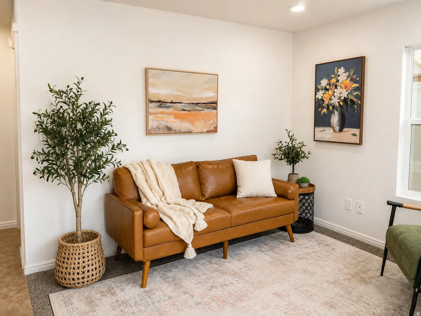Light-filled living space with white walls and recessed lighting