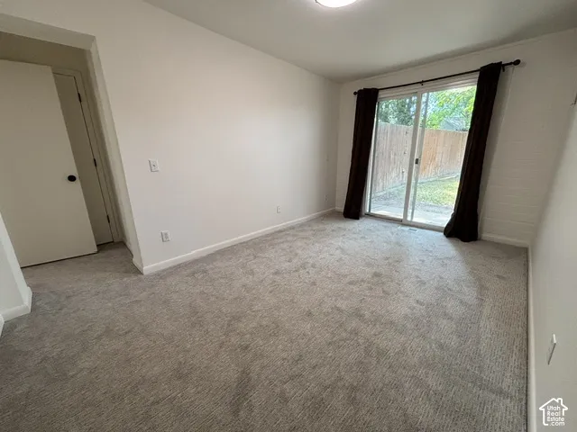 Light gray carpeting with white painted walls