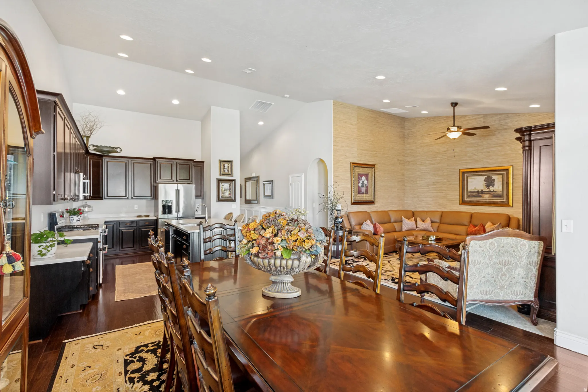 Open-concept living area featuring a formal dining space, kitchen, and living room