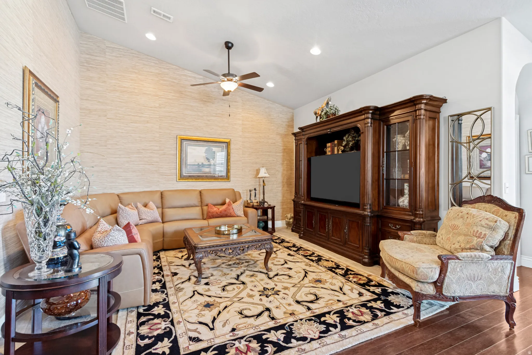 Vaulted ceilings complement the textured accent wall