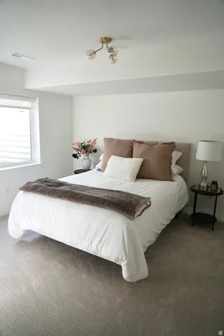 Carpeted bedroom.