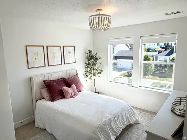 Bright room featuring white walls and recessed lighting