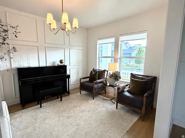 Bright front room featuring a custom decorative accent wall.