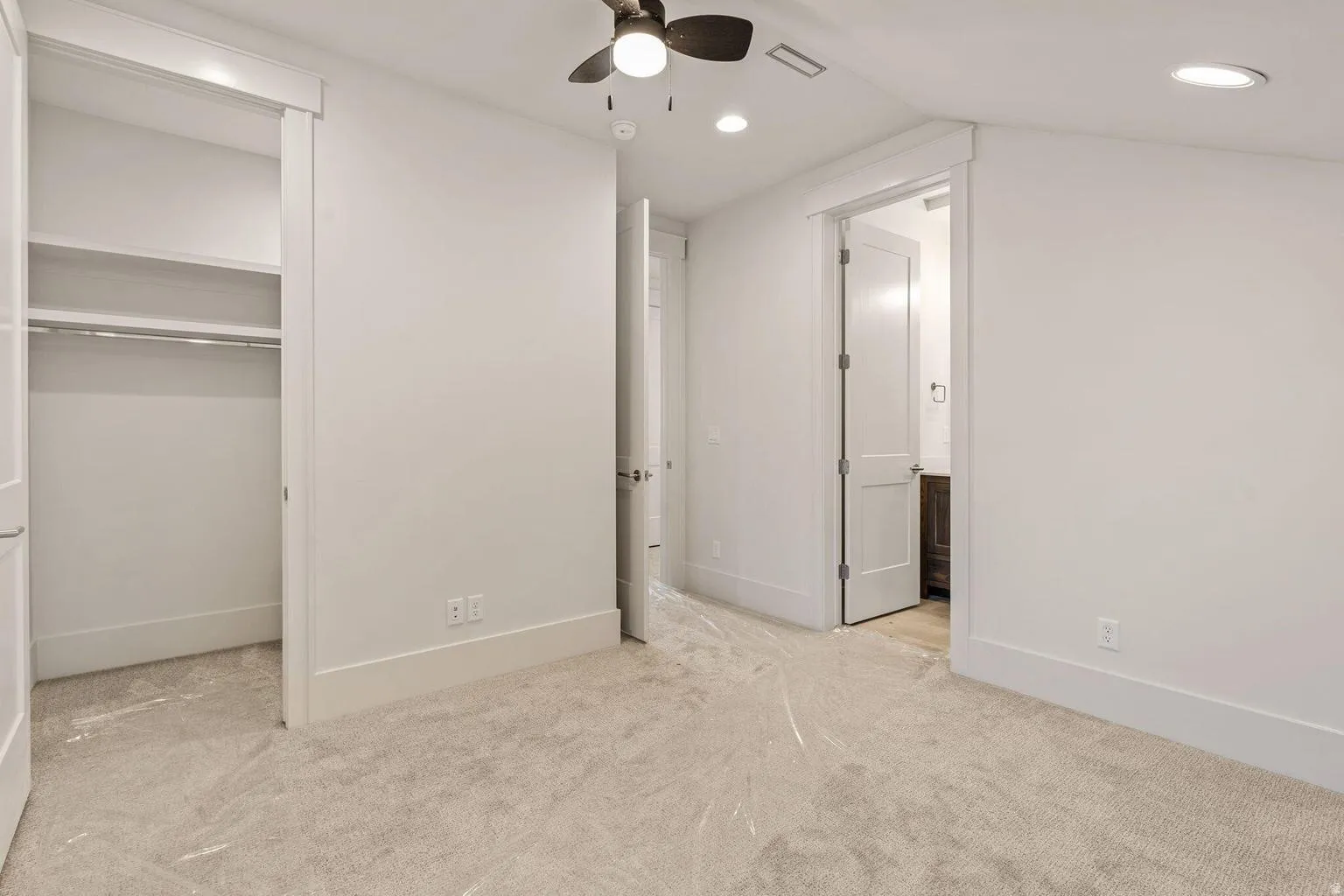 Room featuring plush carpet flooring, recessed lighting, and a ceiling fan
