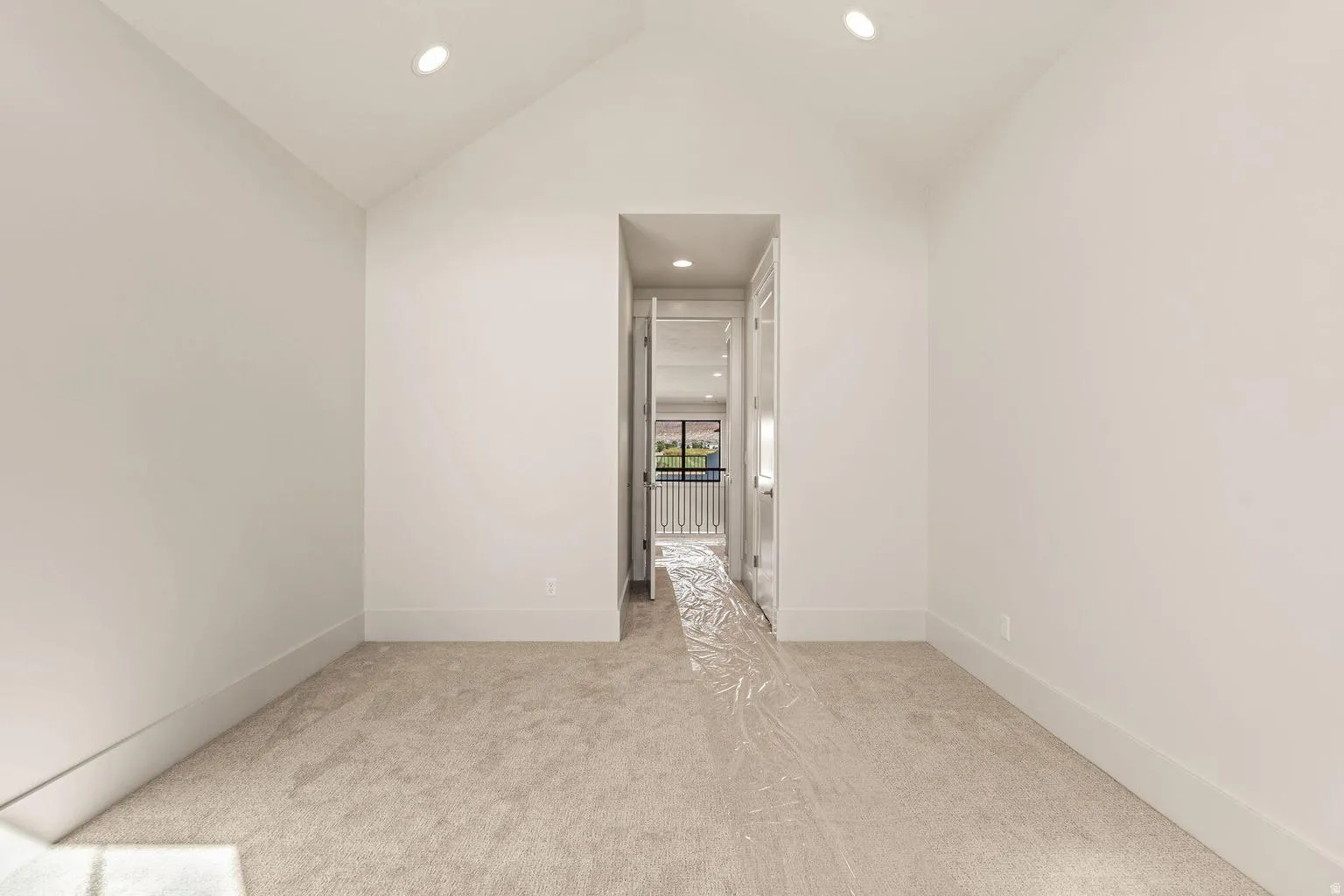 Neutral-toned carpeting paired with crisp white walls and white trim