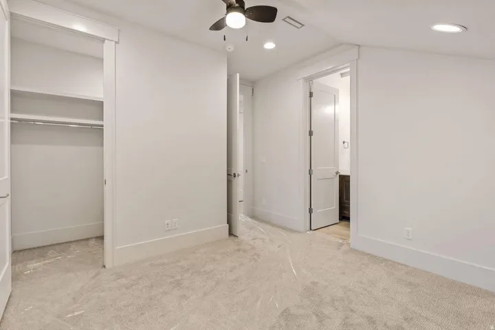Room featuring plush carpet flooring, recessed lighting, and a ceiling fan