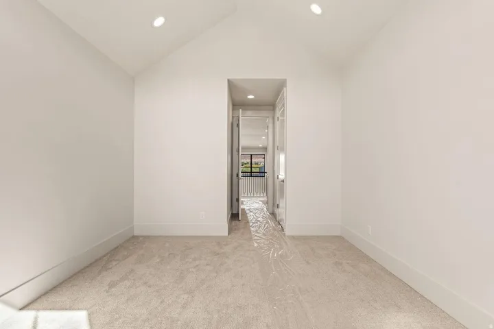 Neutral-toned carpeting paired with crisp white walls and white trim