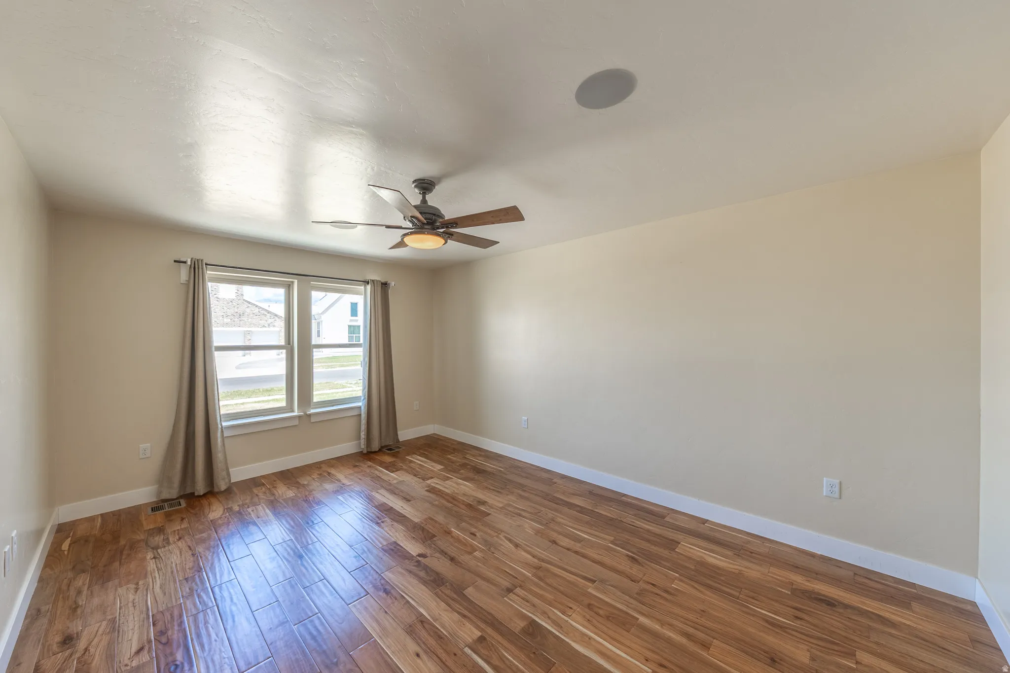 Primary suite with east facing view of the lake. All rooms including great room are wired with speakers in ceiling.