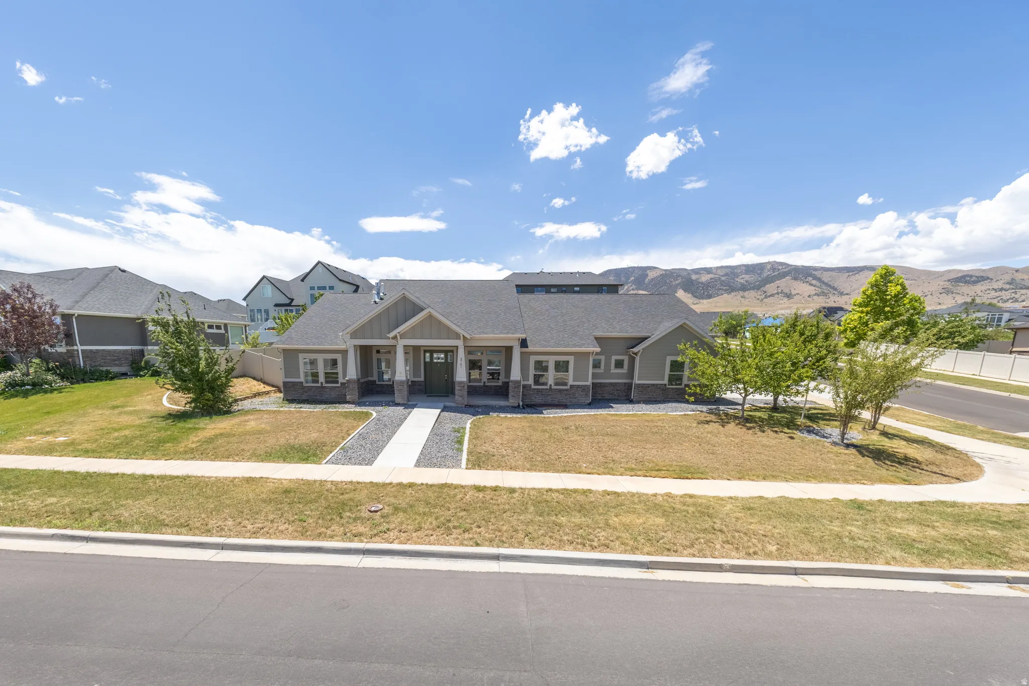 This rambler sits on a corner lot, across the street from Utah Lake.