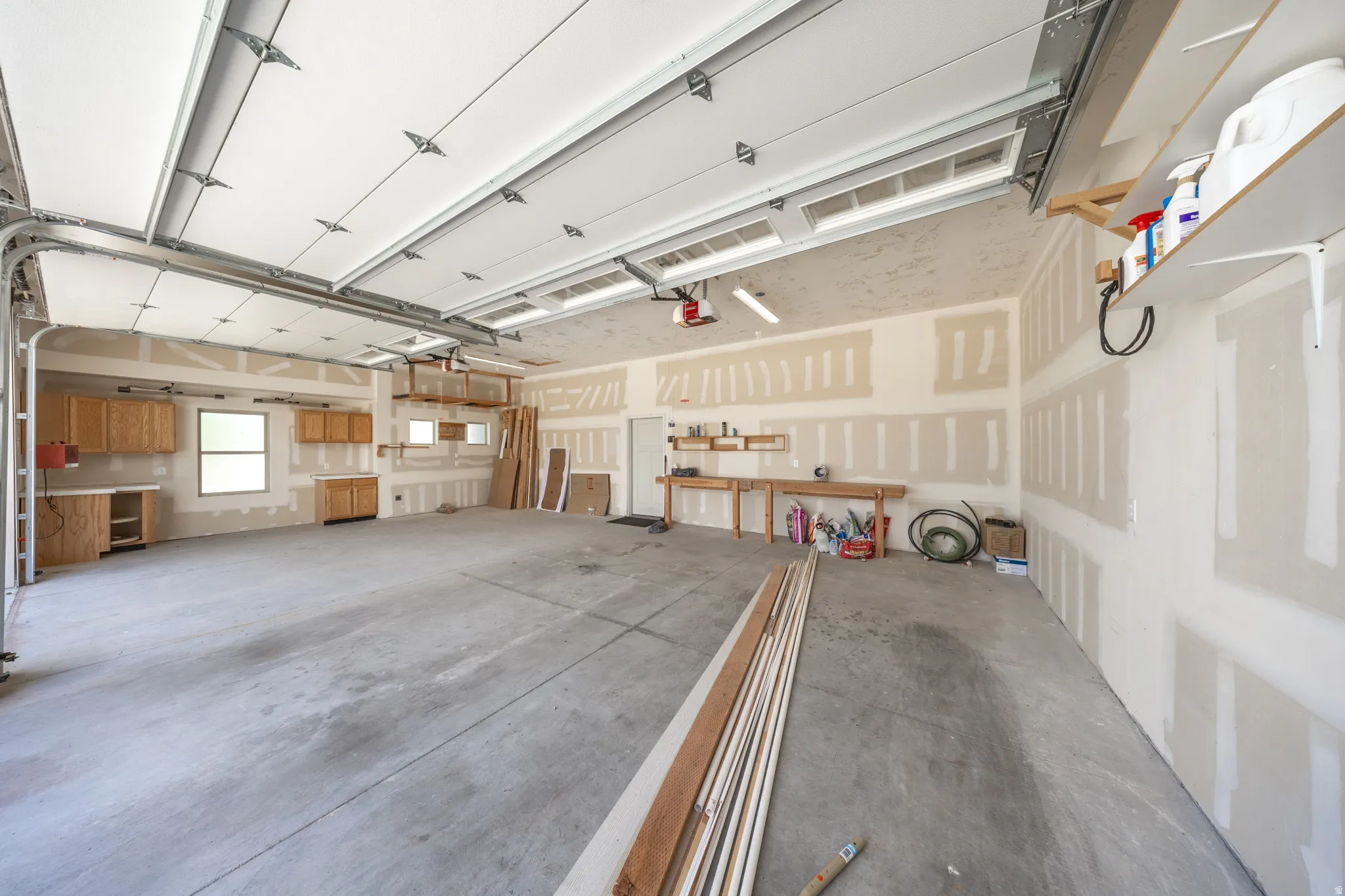 Garage is extra wide. 3rd car garage has cabinetry & 220 power - ideal for a workshop. Garage doors are 10' high, providing clearance for large trucks.