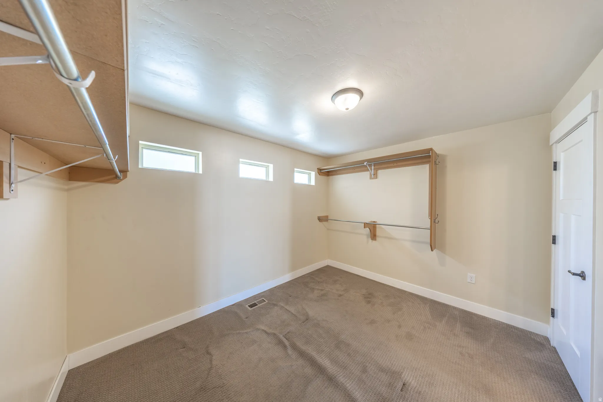 Primary suite also provides a large walk-in closet...WITH a closet. (on the right)