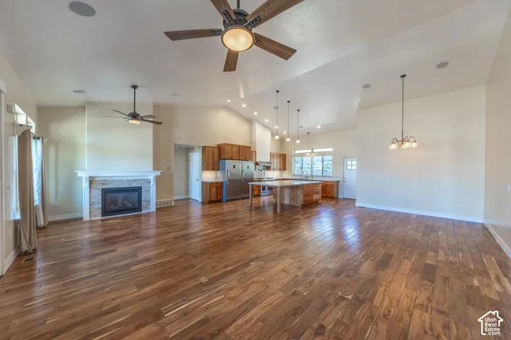Great room is ideal for gatherings. Hard wood floors, vaulted ceilings, lots of natural light.