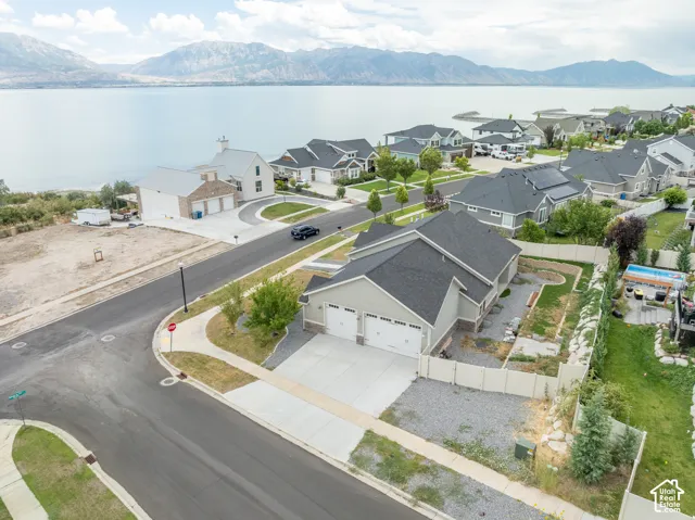 Aerial view of the property, street & lake