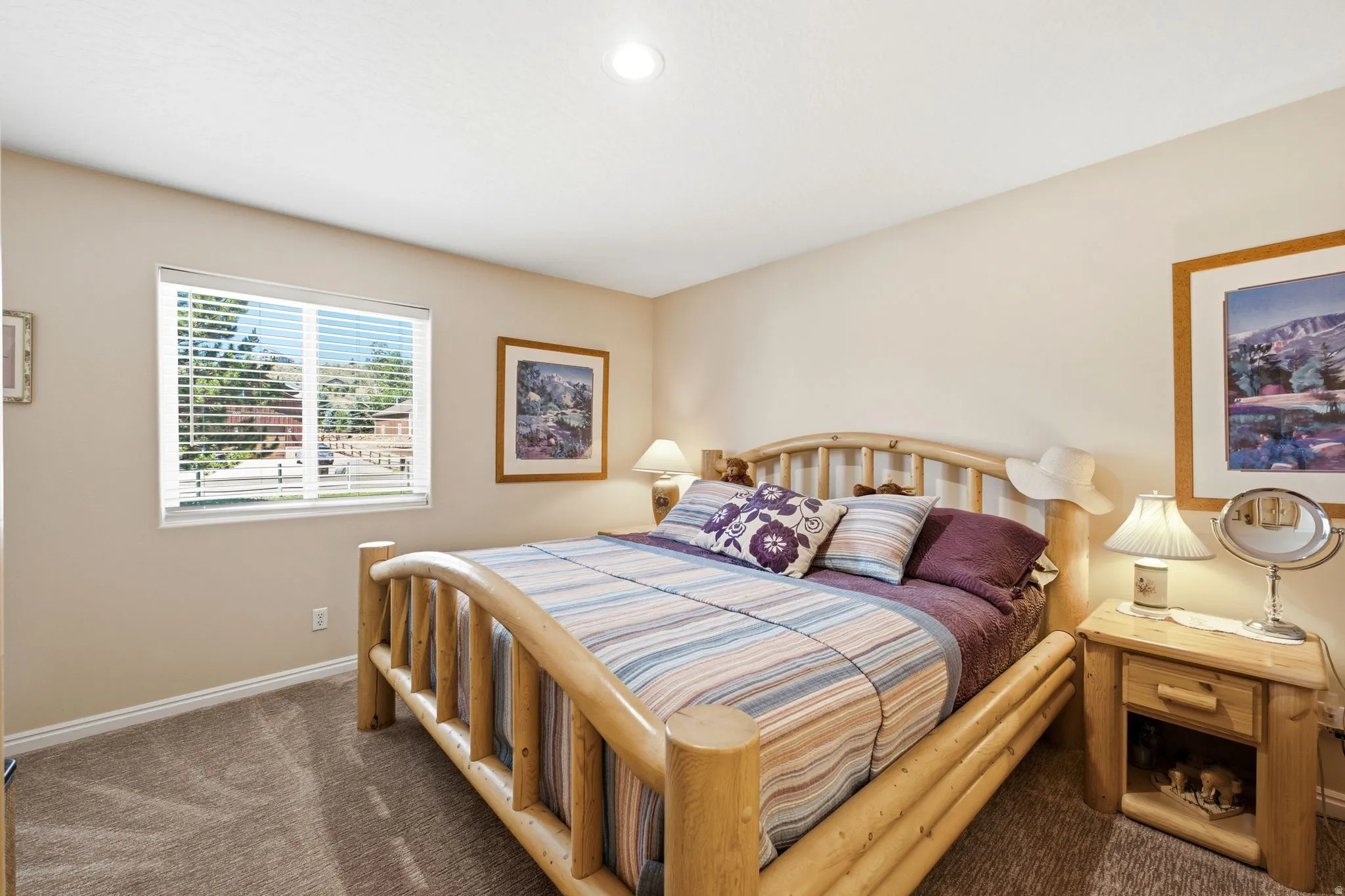 Warm-toned interior featuring a recessed ceiling light, light beige walls, and neutral carpet flooring