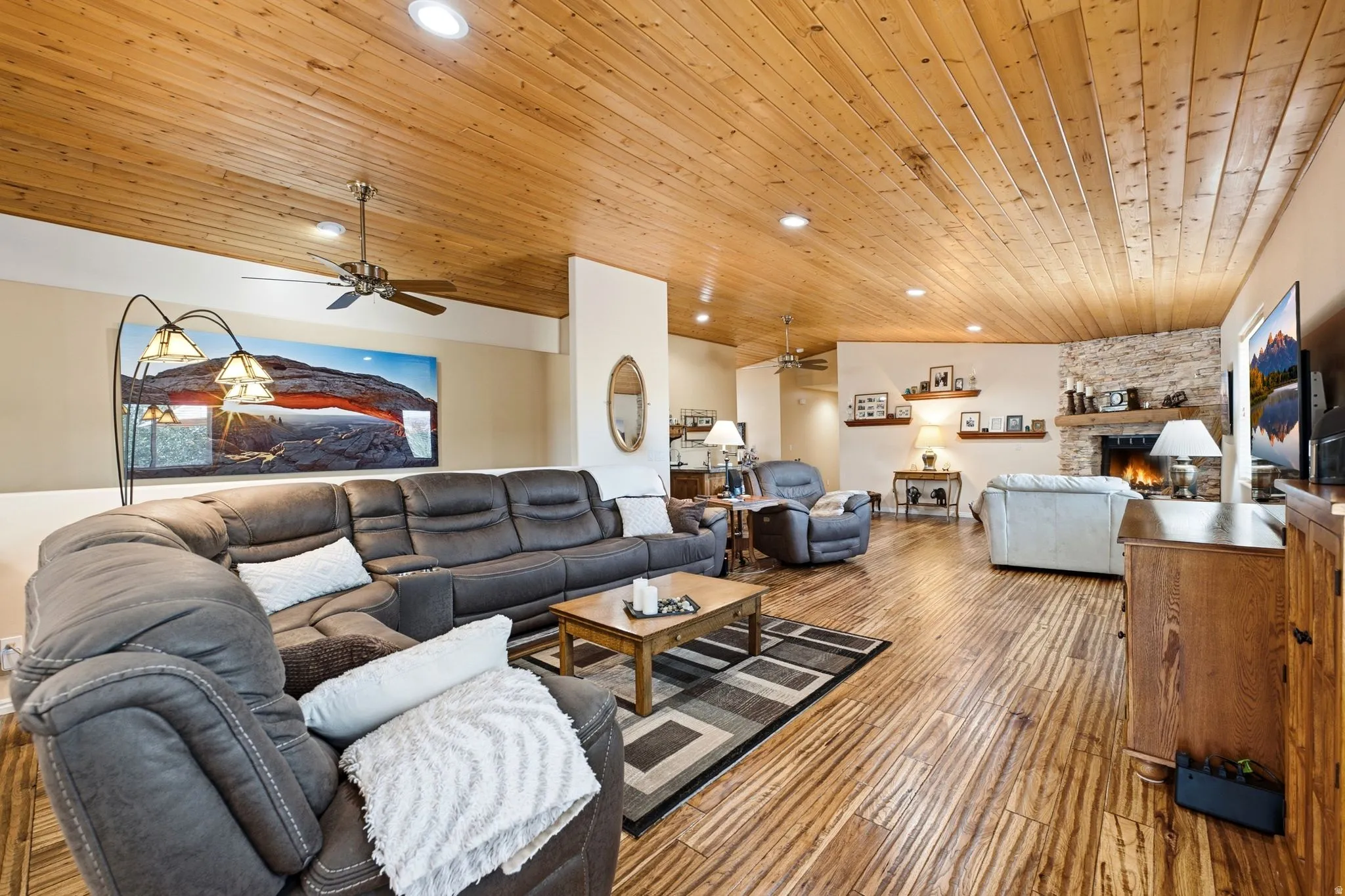Spacious common area featuring wood-finish flooring and a plank wood ceiling