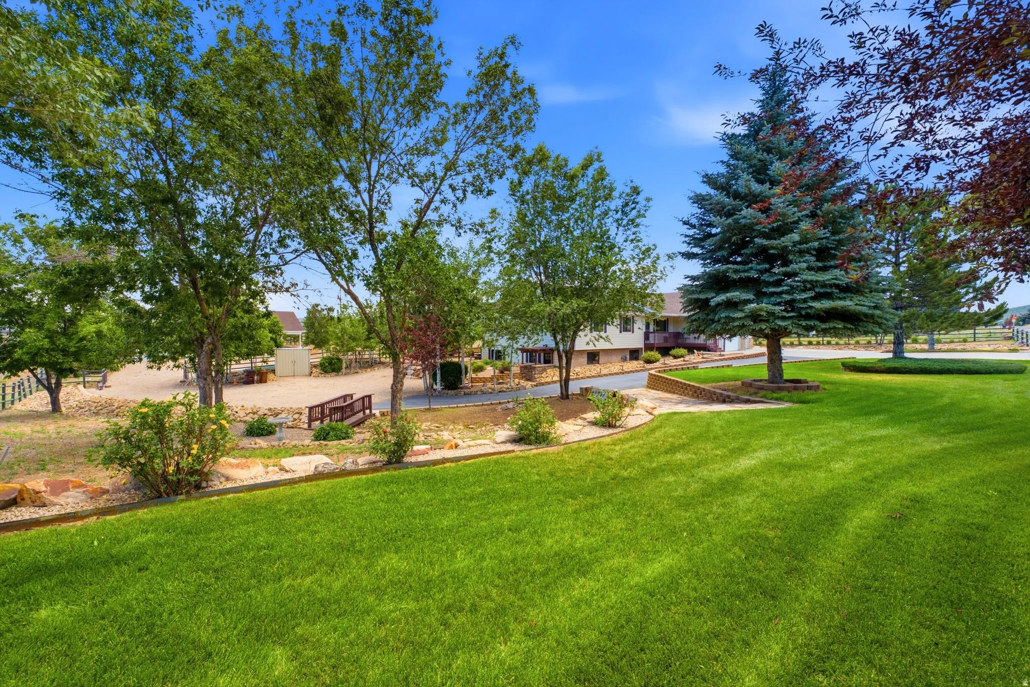 Expansive green lawn with established trees