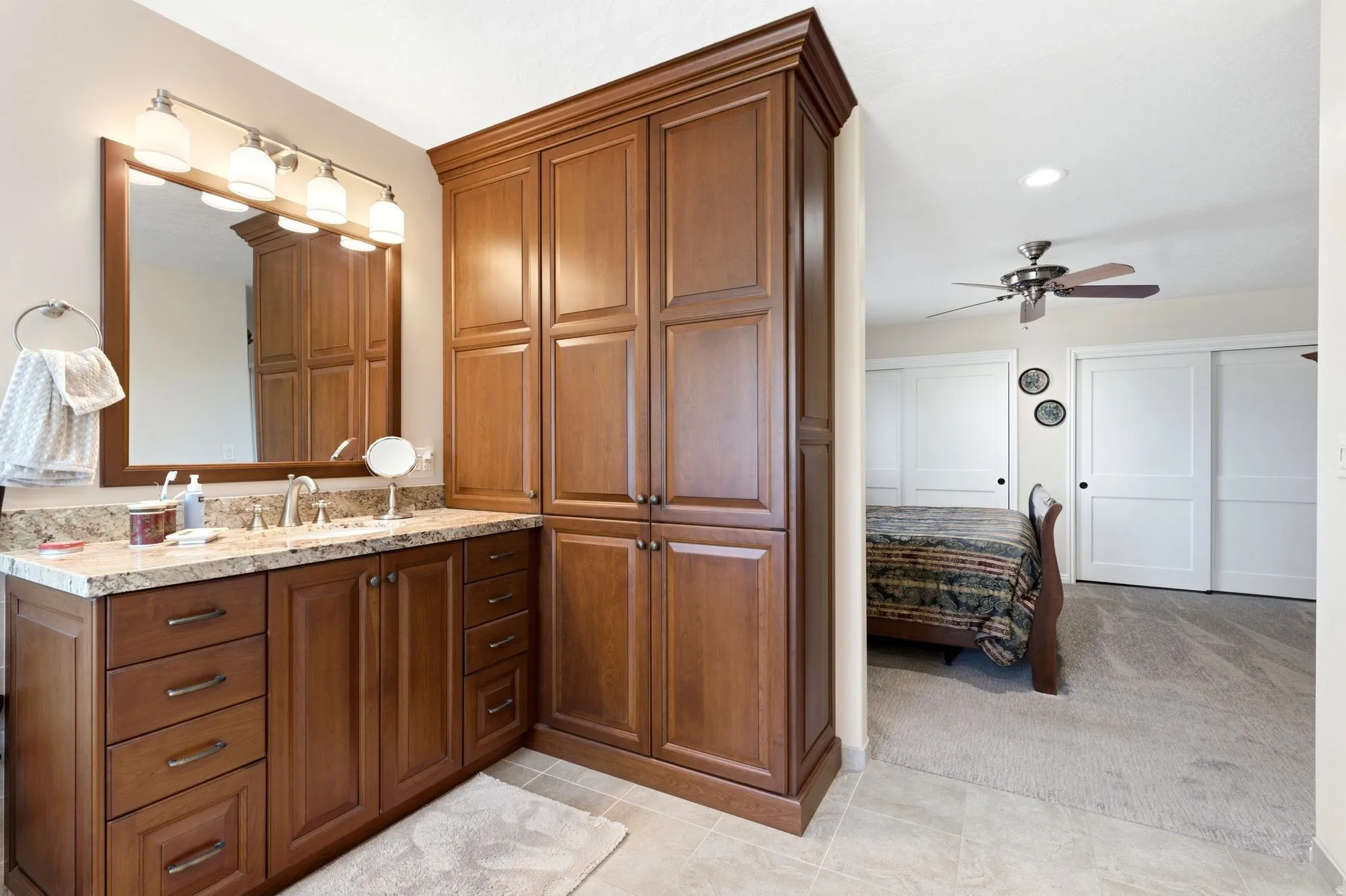 Primary Bathroom vanity with a granite countertop.