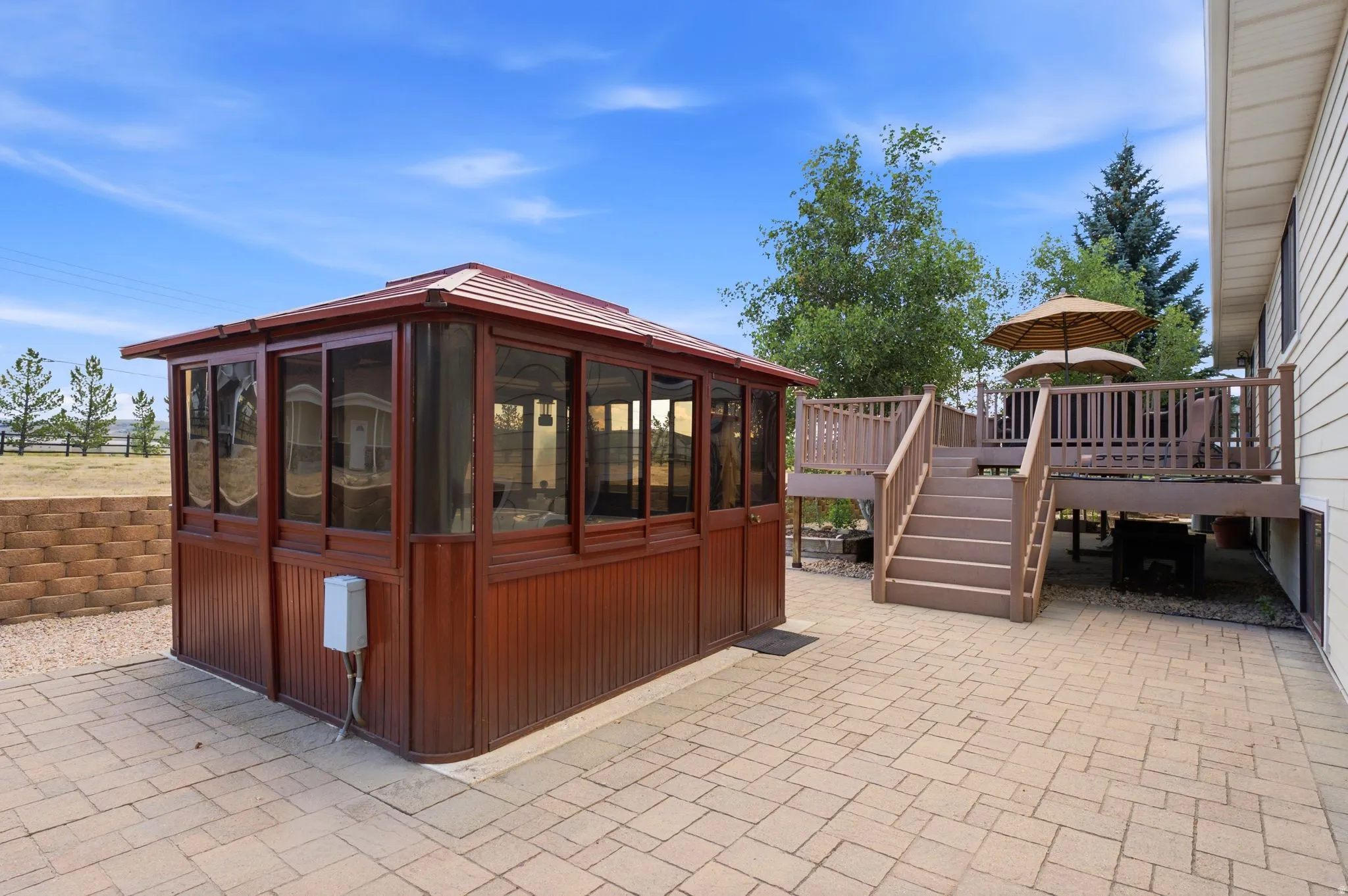 Glass-enclosed hot tub