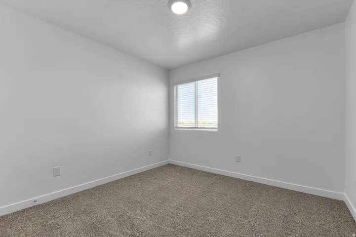 Neutral tone walls and carpeting create a versatile interior