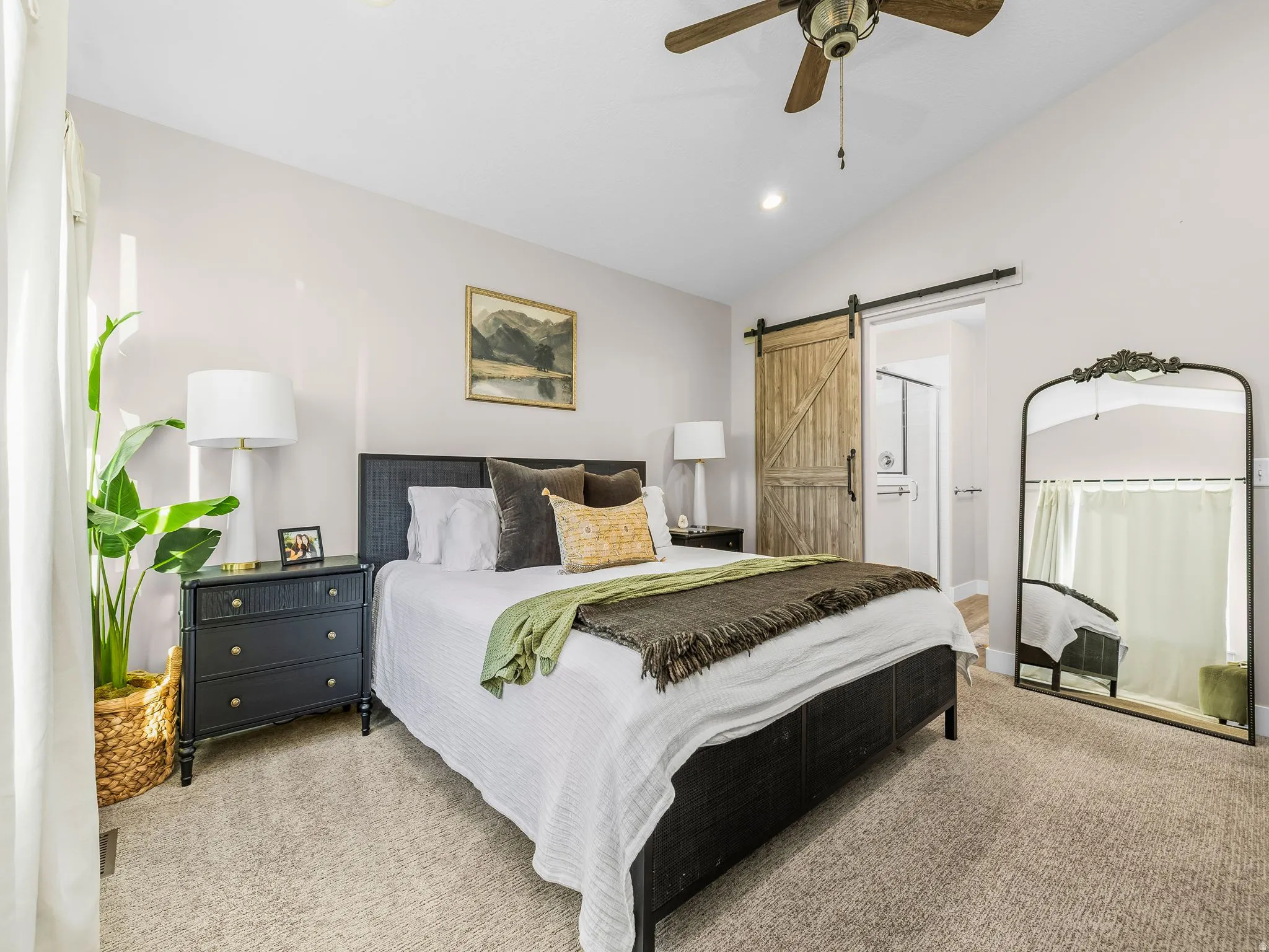 Vaulted ceiling featuring a ceiling fan with integrated lighting