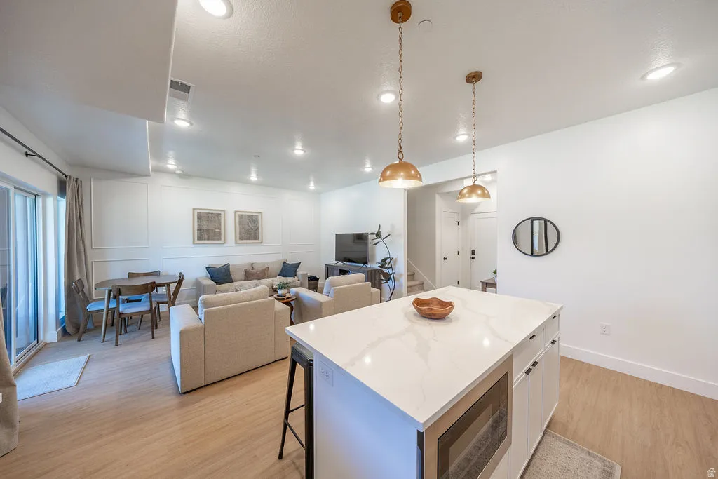 Spacious main level with plenty of seating and added decorative moulding .
