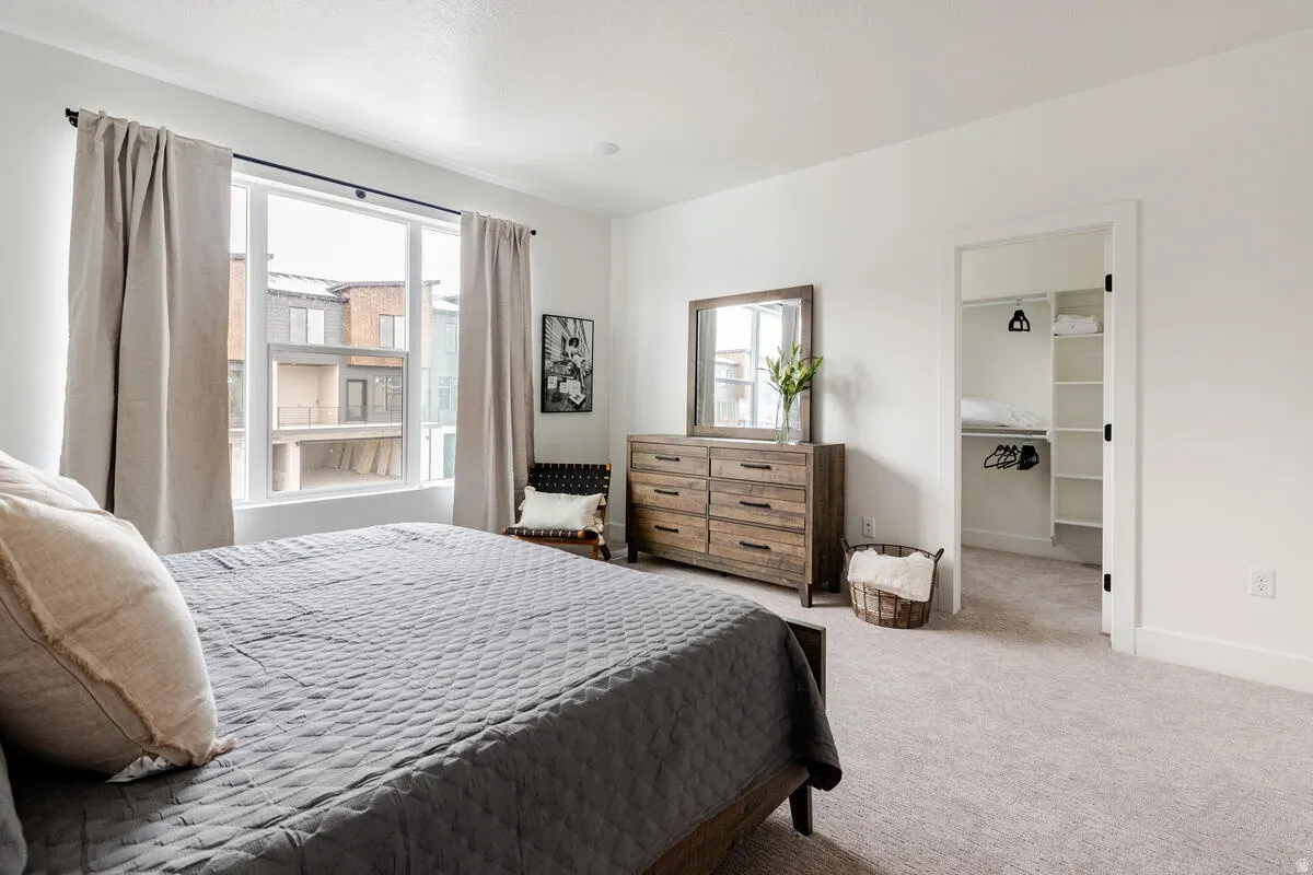 Primary bedroom with LARGE windows, LARGE walk in closet & ensuite.  West facing window.
