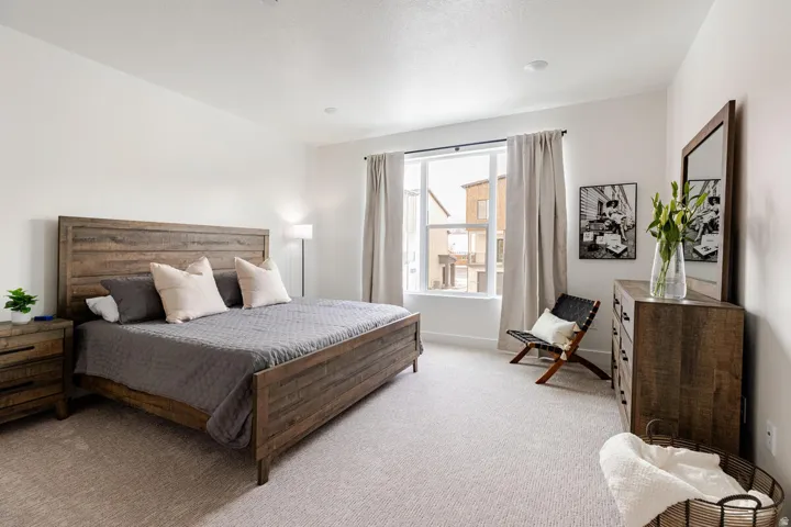 Primary bedroom with large walk in closet, large windows and full ensuite bathroom.