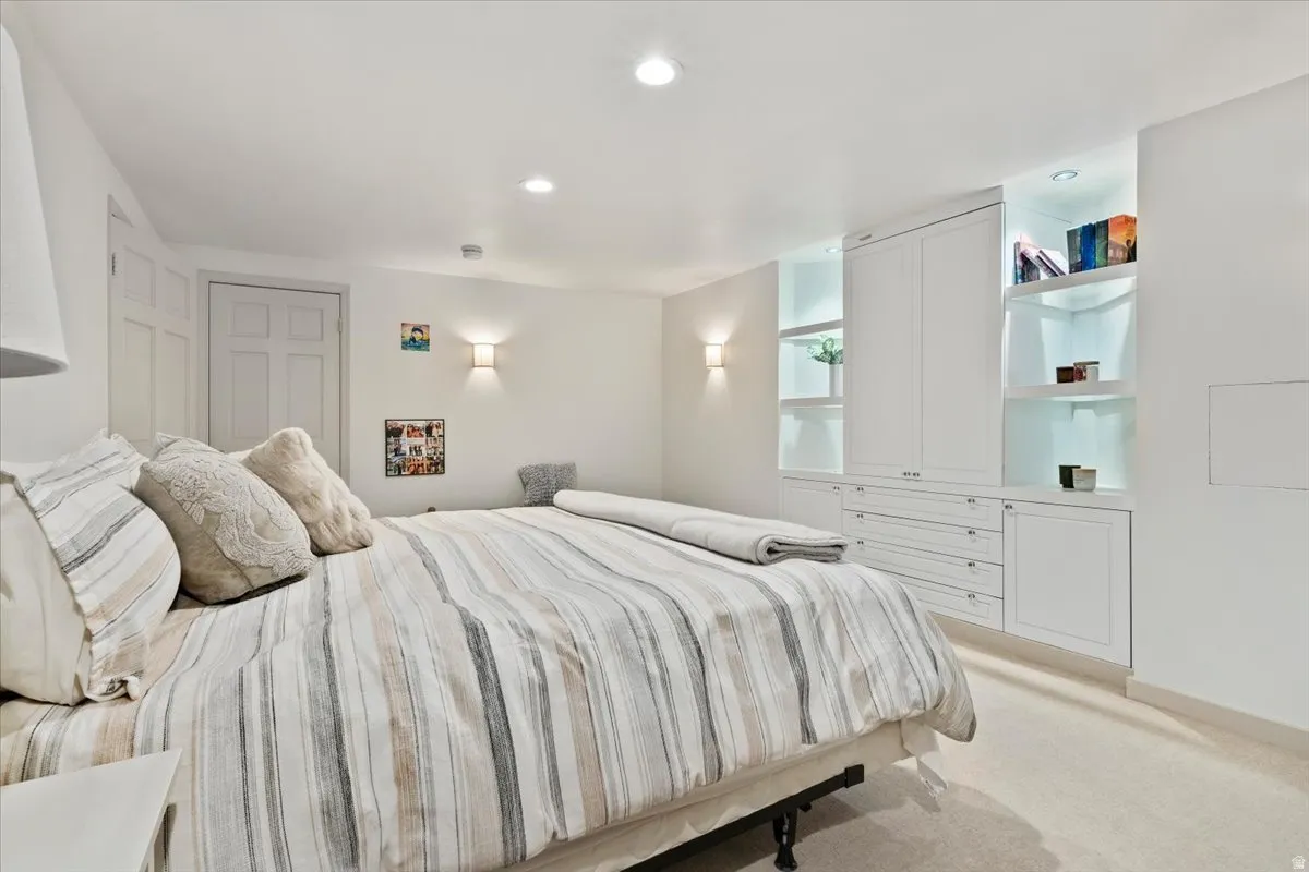 Built-in cabinetry featuring integrated lighting, shelving, and drawer storage