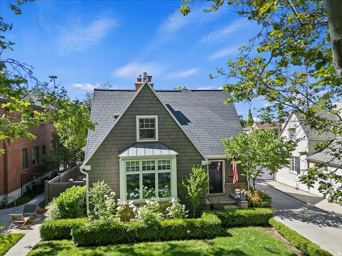Gabled architectural style with a bay window and shingle siding