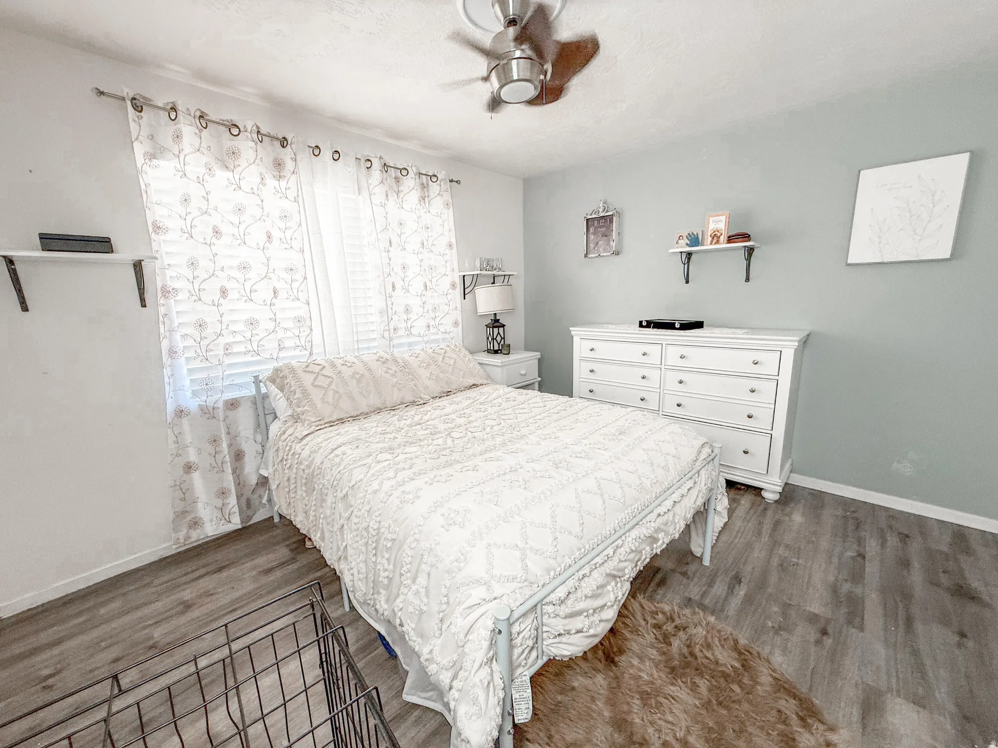 Bedroom featuring light wood-finish flooring and a ceiling fan