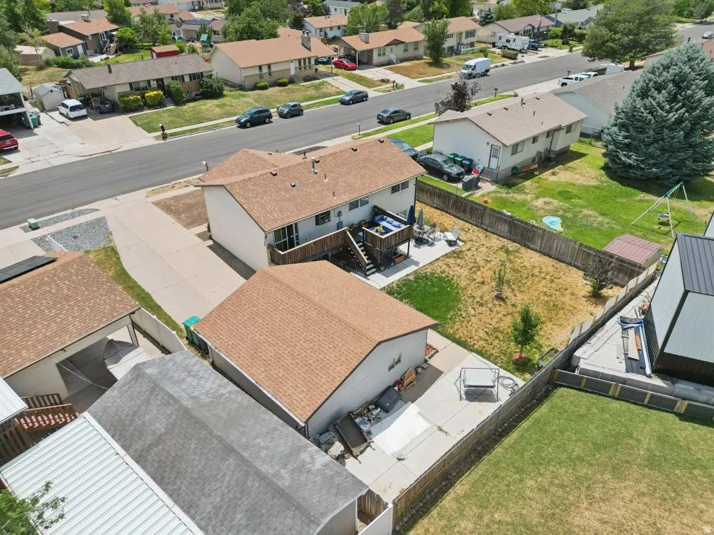 Spacious rear yard with a multi-level deck and privacy fencing