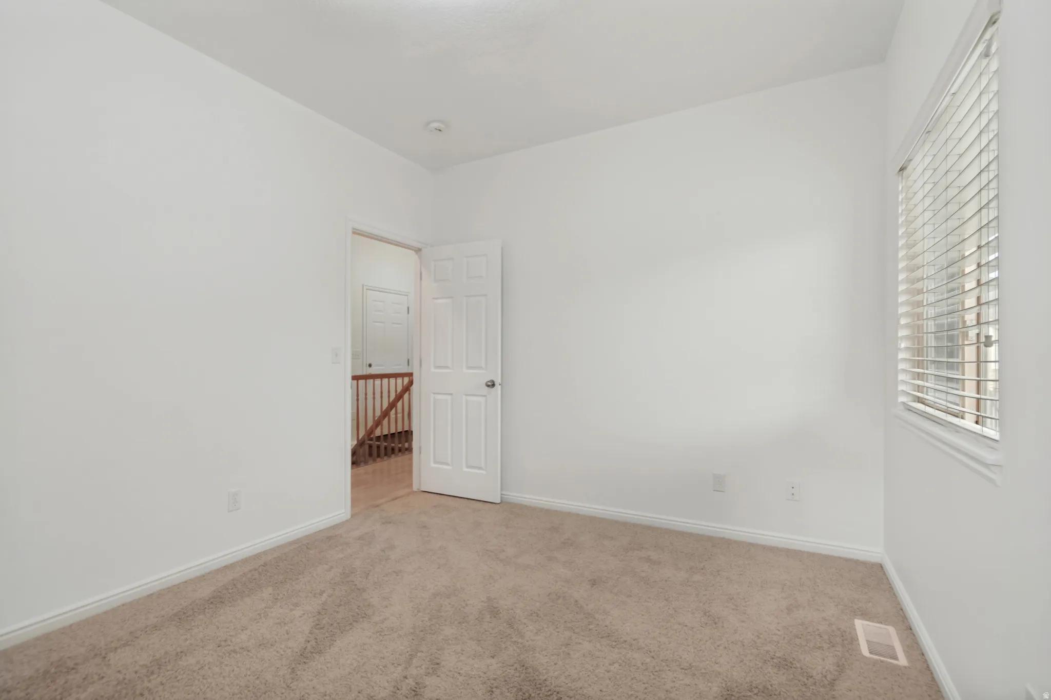 2nd bedroom with new carpet