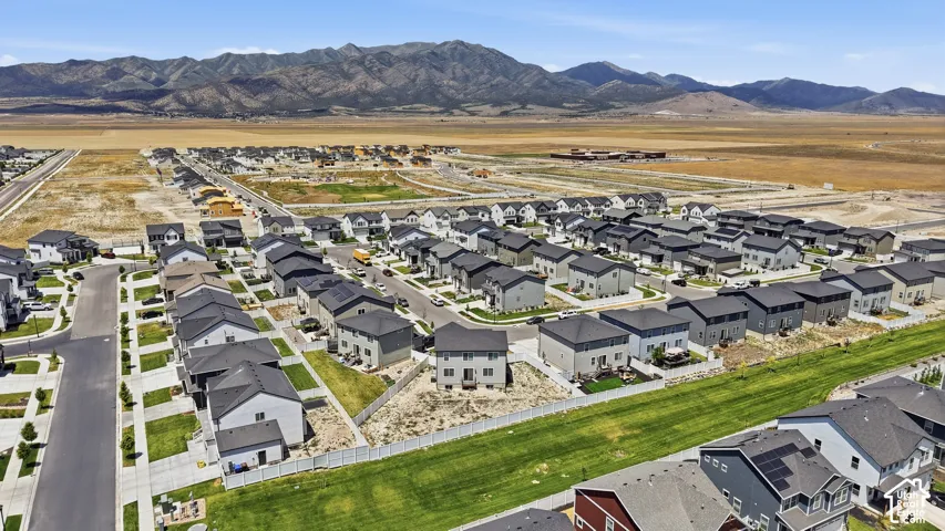 Expansive residential development featuring contemporary homes with dark shingle roofs