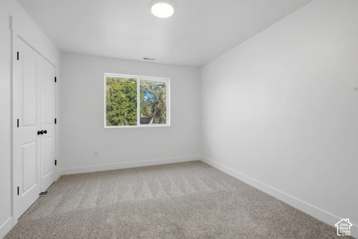 Bright room with neutral wall finishes and a contemporary flush-mount ceiling light
