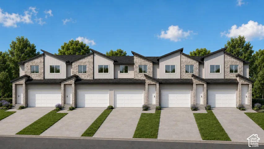 Modern townhome exterior with stone and siding accents, prominent individual garage doors, and landscaped entryways