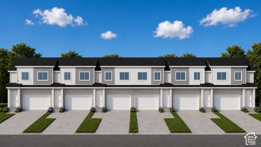 Modern townhome exteriors featuring individual garages and private driveways