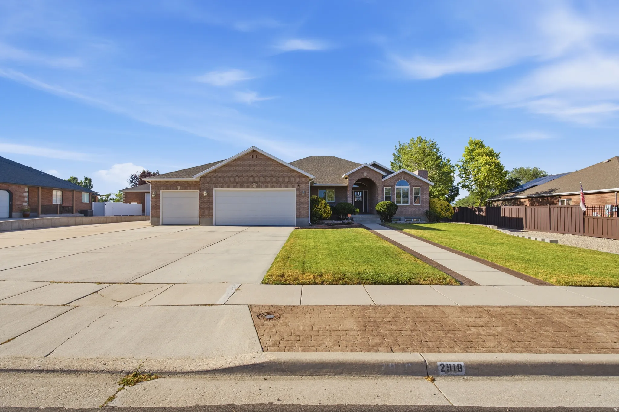 Brick exterior with a prominent two-car garage