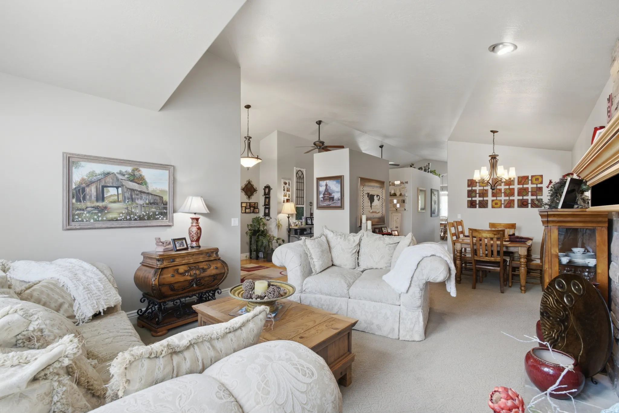 Open-concept interior featuring vaulted ceilings and recessed lighting