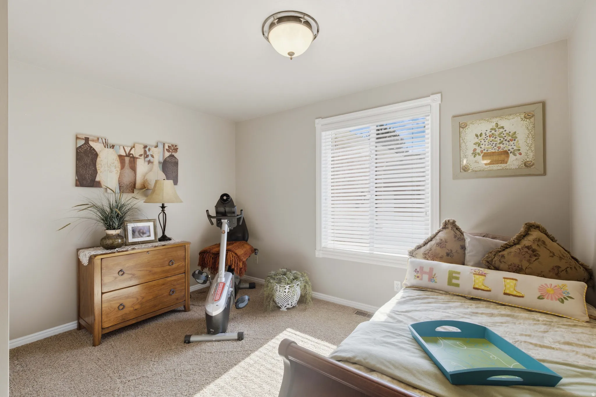 Neutral wall tones complement the neutral carpet flooring