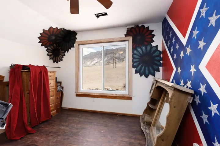 Interior space with a window offering a mountain landscape view