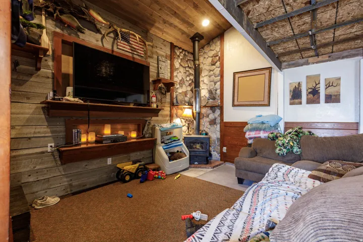 Interior space featuring wood-paneled walls and a wood-finish ceiling