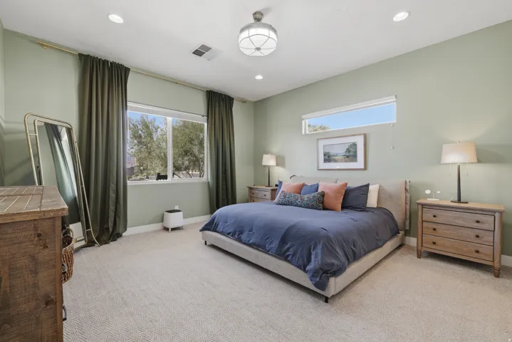 Bedroom featuring recessed lighting, a ceiling-mounted light fixture, and light green wall paint