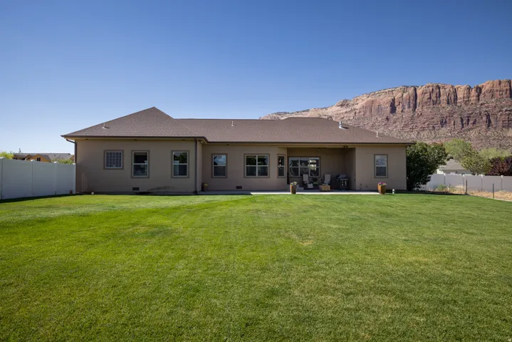 Expansive green lawn with mountain backdrop