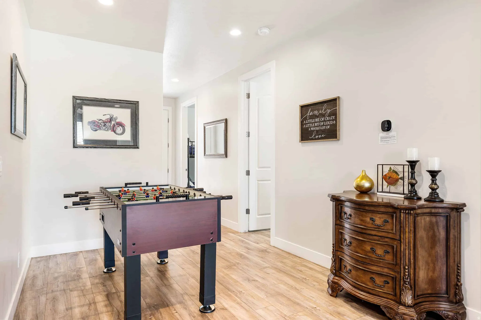 Hallway featuring wood-finish flooring and recessed lighting
