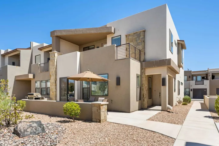 Contemporary exterior featuring stucco finishes and stone accents