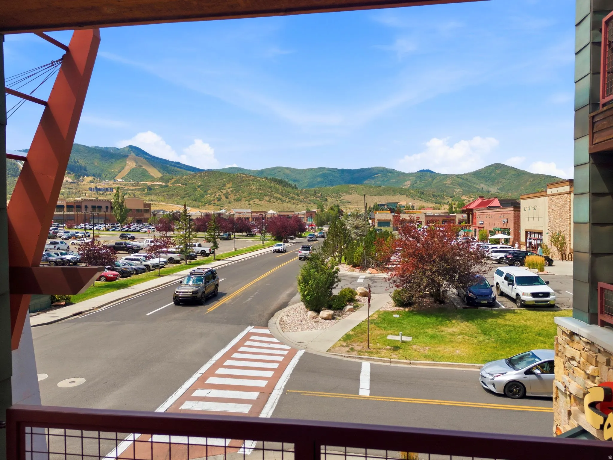 Expansive mountain backdrop with scattered residential and commercial structures